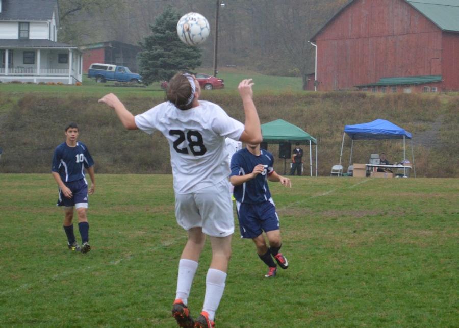 Senior Bailey Christine plays the ball out of the air vs. Penns Valley