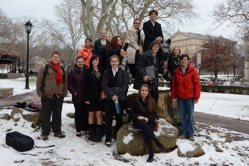 The team stops for a group photo at the Panther Shrine on the Pitt campus.
Left to right (back row): Carrie Vance, Erika Voyzey, Makayla Ritchey, Connor Stroud, Jake Makdad, Molly Fessler-LaPorte.  Second row: Attorney adviser Rich Lupinsky, Paige Umholtz, Shaniah Lowery, Hope Wilson, Haley Butina, Adam Zook, faculty adviser Todd Cammarata.  Front row: Gina Gavazzi
