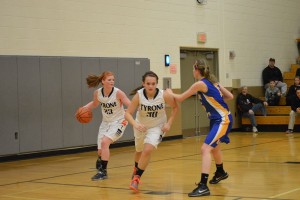 Senior Emily Iuzzolino rebounds the ball and sends it down court.