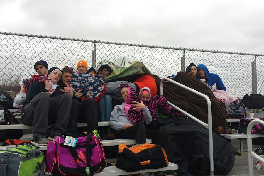 Track members huddled together because of the very cold conditions.