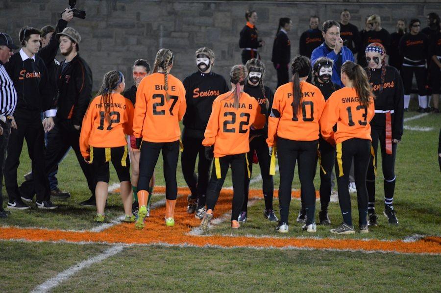The coin-toss of the Annual Seniors vs. Juniors Powder-puff Game