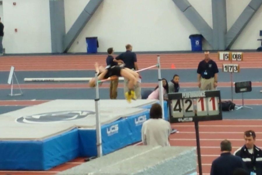 Erika clears the bar at 58 to win the meet and set a new meet record in high jump.