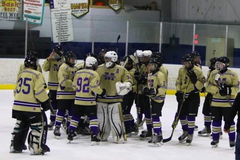 The BG team congratulates Tyrone senior goaltender Trent Bogert after the big win.