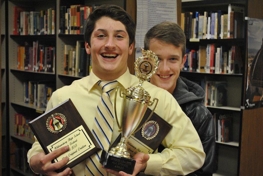 Junior AJ Grassi with several awards that he didnt win, as senior Adam Zook looks on.