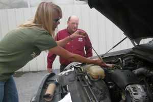 Carly Crofcheck Servicing an engine during the Production Ag practicum.