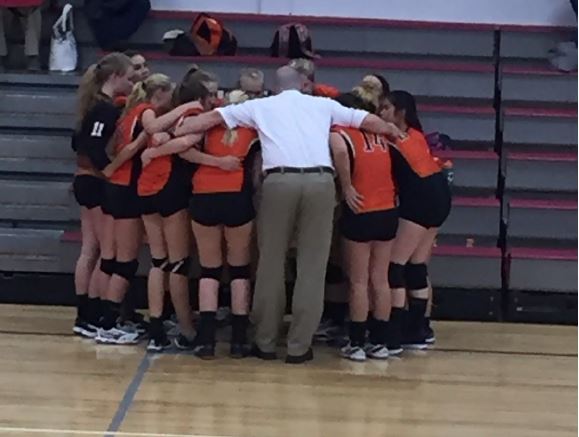 Girls huddle after a big win