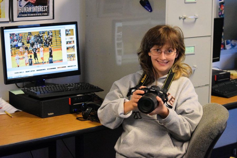 Bev at her Eagle Eye workstation editing photos she took at a recent boys basketball game.