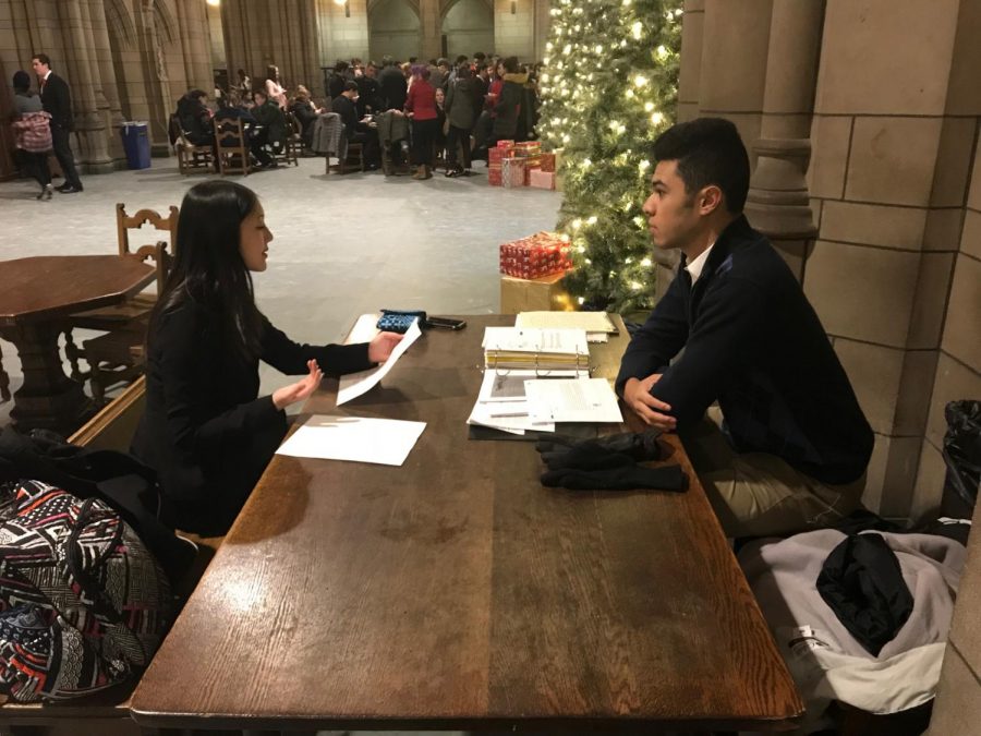 Junior Brandon Escala (right) prepares for a mock trial competition with senior Molly Harris  (right) at the annual Pitt Mock Trial Invitational in Pittsburgh