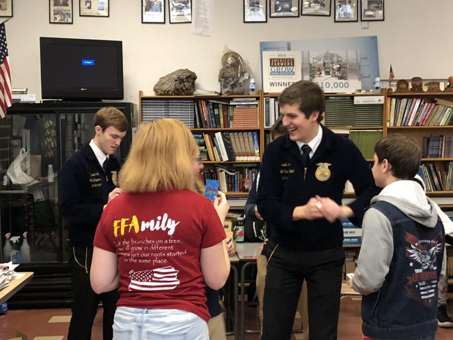 State FFA reporter Sam Loy (far left) and vice president Jacob Kinzer (second from right) are seen here talking with members of theTyrone FF.  The pair visited the local Tyrone chapter on November 29.