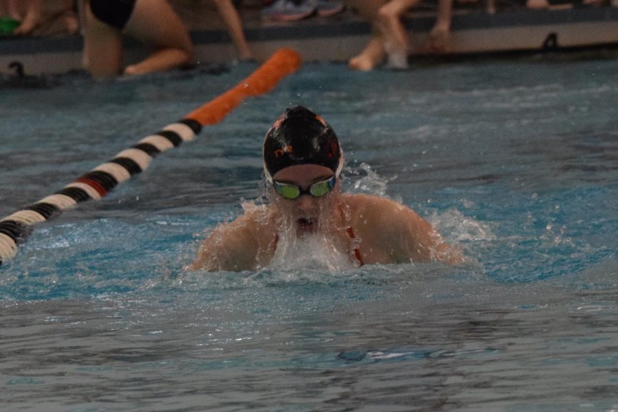 Fiona McConnell, a Bishop Guilfoyle junior, pulls through the water during the breaststroke