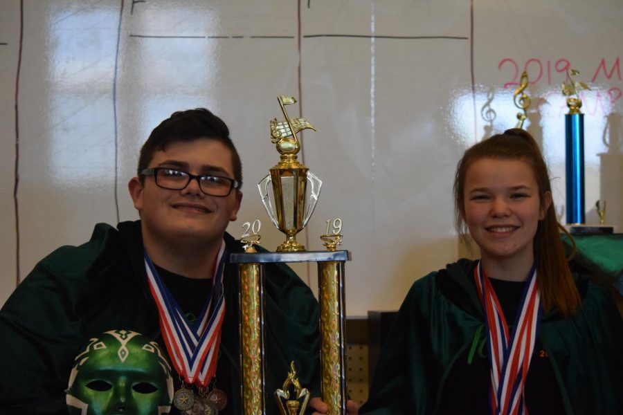 Andrea Ubaldi and Emily Detwiler sporting their previous chapters medals with the First place trophy