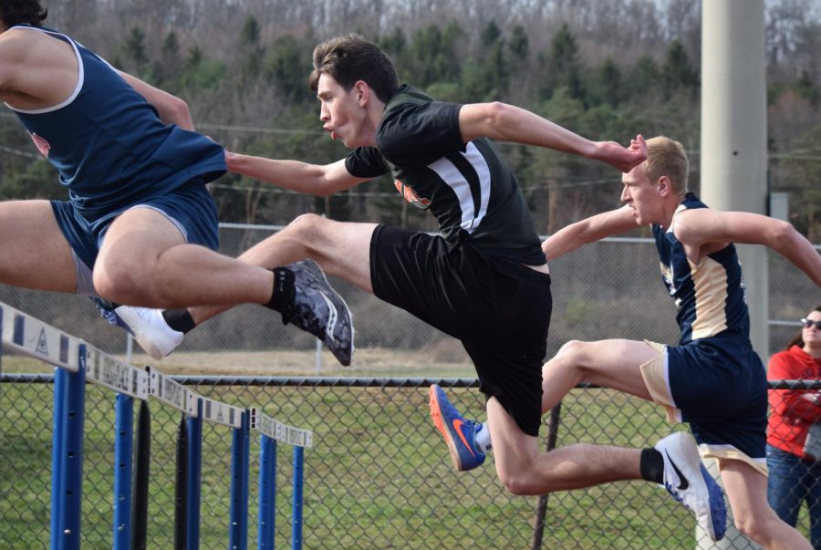 Nathan Walk competing in hurdles against Bald Eagle