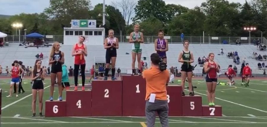 Tyrones McKenzie Latchford on the podium for the 100m 