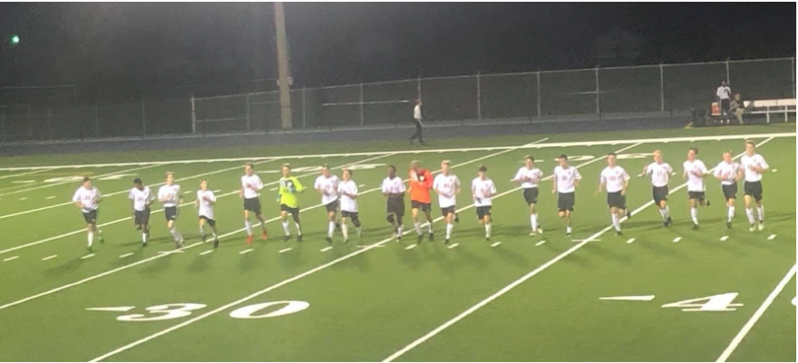 Golden Eagles soccer team doing their cool down after the game.