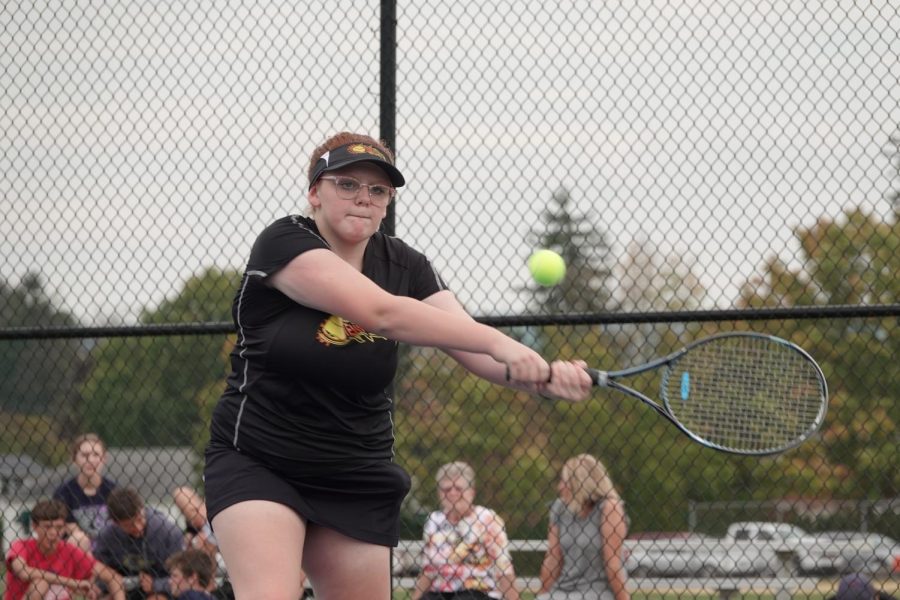 Lydia Irvin hits a winning shot. 