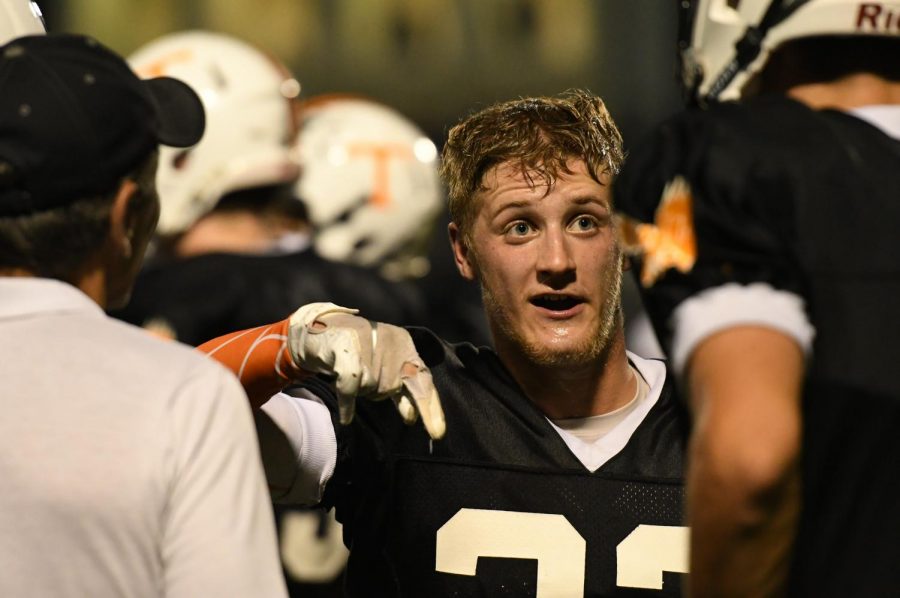 Brandon Homan discussing a play on the sidelines