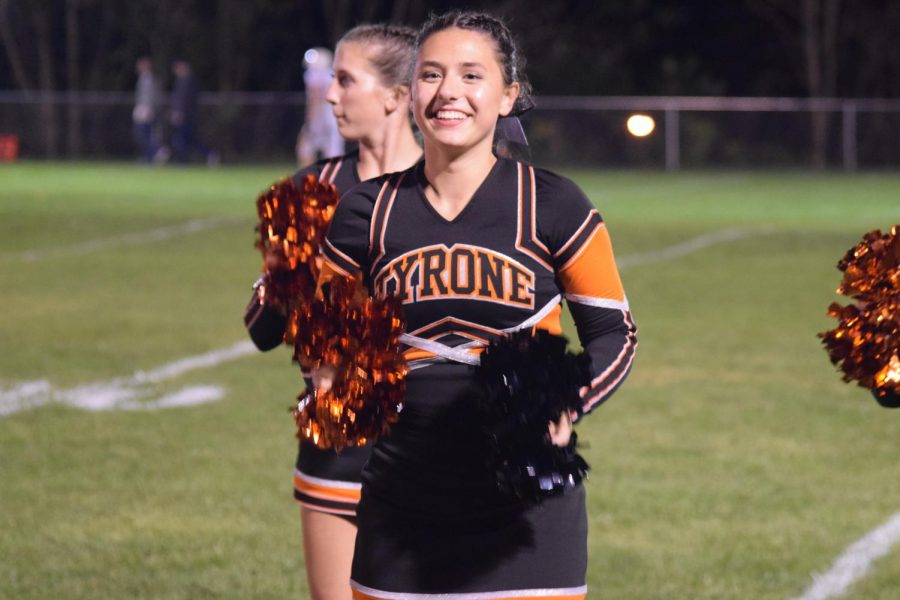 Grace Legars cheering on the sideline.