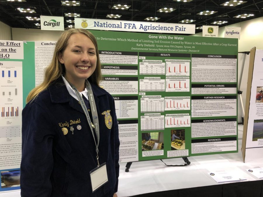 Tyrone junior Karly Diebold stands with her 2019 Agriscience project at the 2019 National FFA Convention in Indianapolis, ID. Diebold placed fifth in the nation this year.