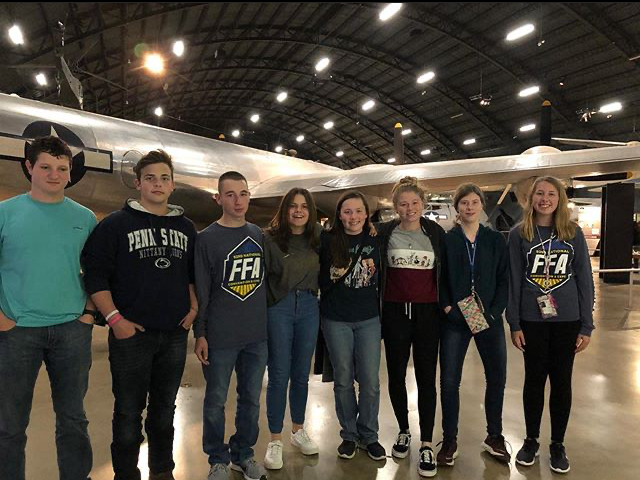 Tyrone Area FFA members pose in the beginning hanger of exhibits at the Air Force Museum.