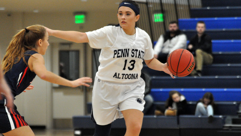 Penn State senior Finnley Christine calls out a play as she brings the ball down the court for the Penn State Altoona Lady Lions.