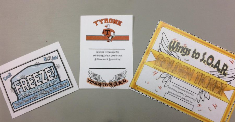 Three of the "tickets" that TAES elementary students can receive for positive behavior.  The "freeze" ticket for positive hallway behavior, the regular "SOAR" ticket, and the new "Golden" ticket for going above and beyond.