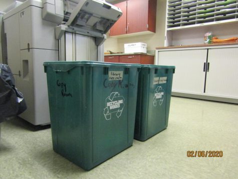 Shows the recycling bins in the copy room at JV