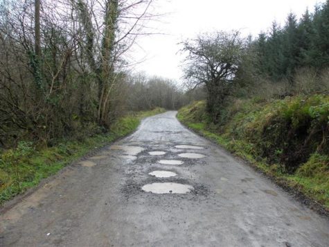 photo of road with potholes