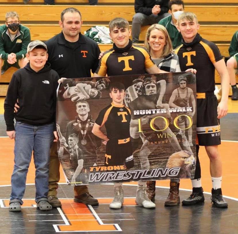 Tyrone senior Hunter Walk celebrates his 100th victory with his family.