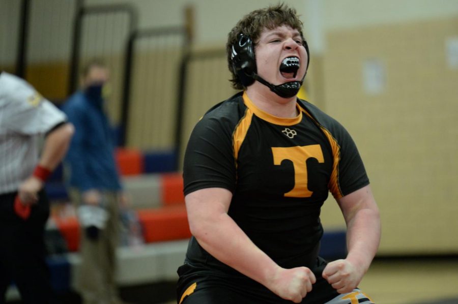 Freshman+Braden+Ewing+celebrates+his+match+clinching+pin+at+Sectionals.