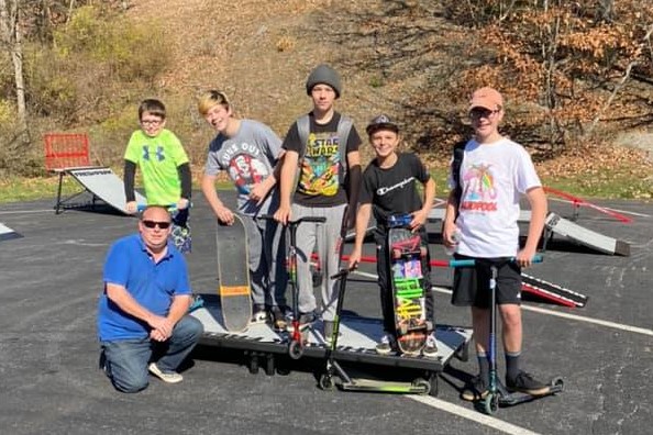 Mayor Latchford (bottom left) poses with some of the local skatepark. 