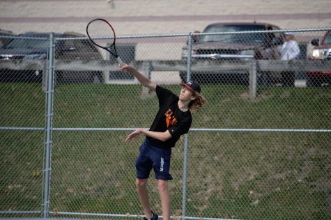 Will Grot smacks the ball across the net during a match