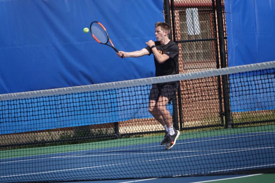 Kelton returning a serve.