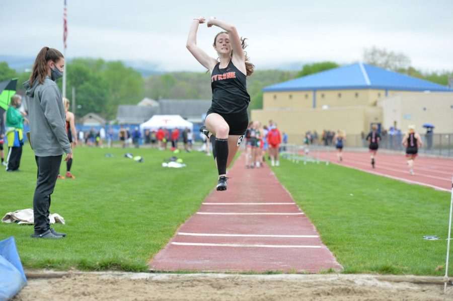 Chesney Saltsgiver jumping in the long jump
