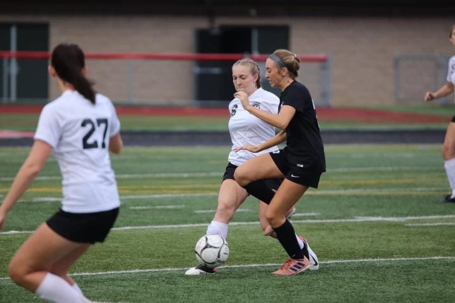 Senior Kenzie Latchford defending the ball from Clearfields player.