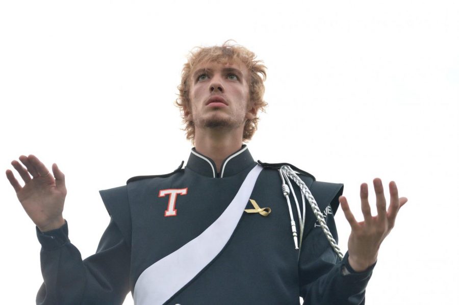 Tyrone Drum Major Jake Greene, seen here directing the bands 2020 halftime show,  makes his composing and arraigning debut this fall with the TAHS Marching Band's 2021 show:  “Pulse, Rhythm of the Heart,''