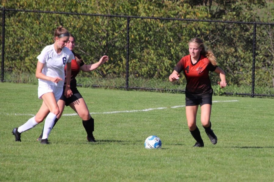 Sophomore Becca Lewis defending the ball from Hollidaysburg player.