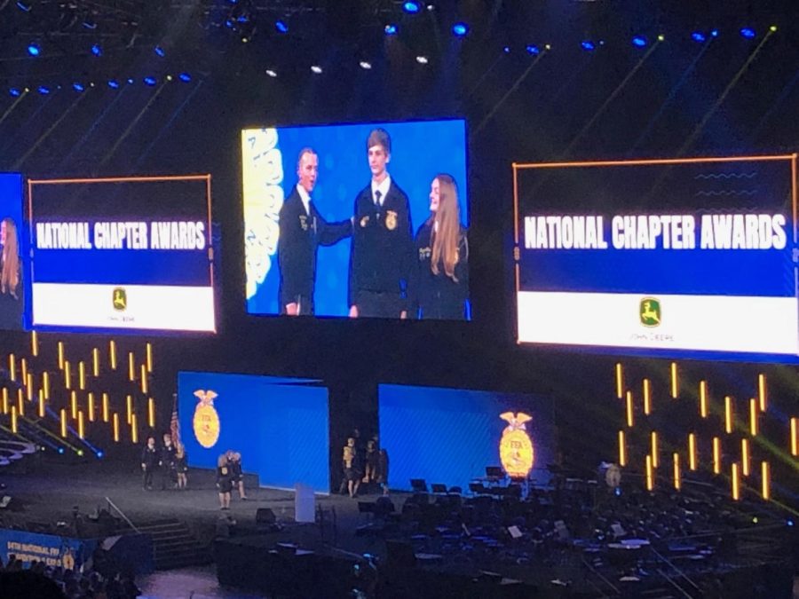 Junior Leo Veit and Rayann Walls are on the stage representing the Tyrone Area FFA Chapter for the National Chapter Awards.