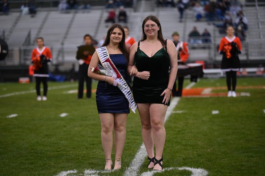 Marina Beck representing drama club and escorted by Hailey Fisher.