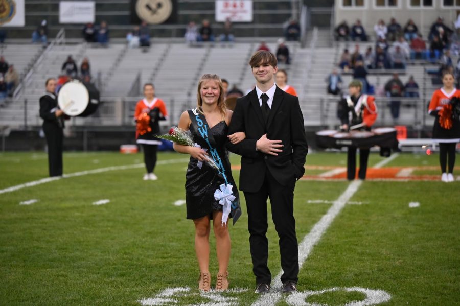 Kiersten Friday representing swim team and escorted by Will Price.