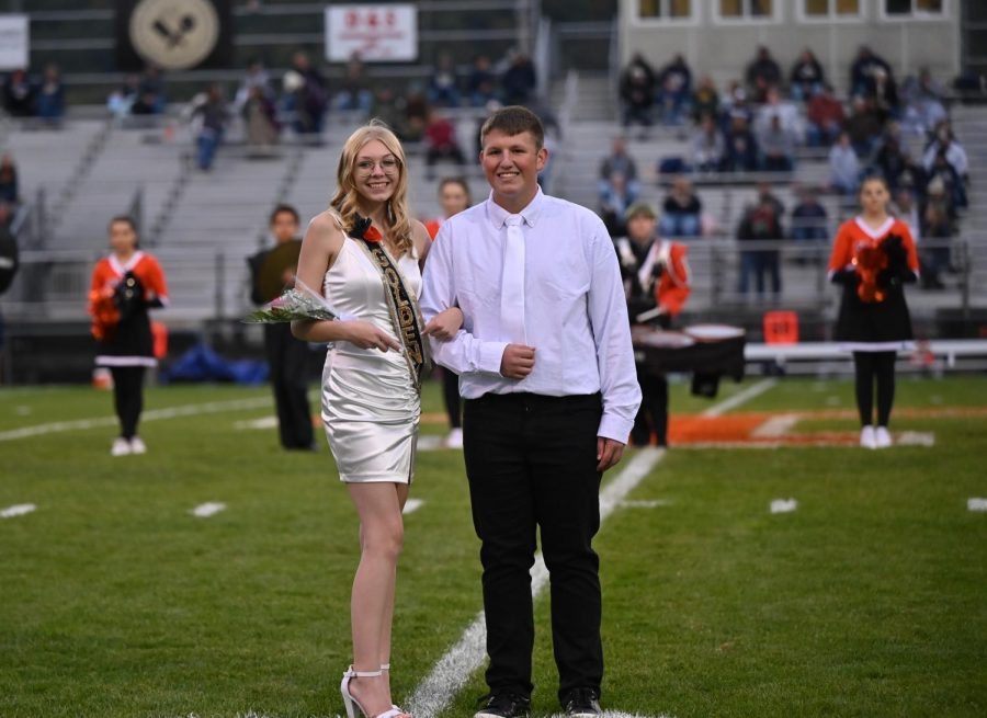 Baylee Mertiff representing Golden Revolution and escorted by Kevin Carper. 