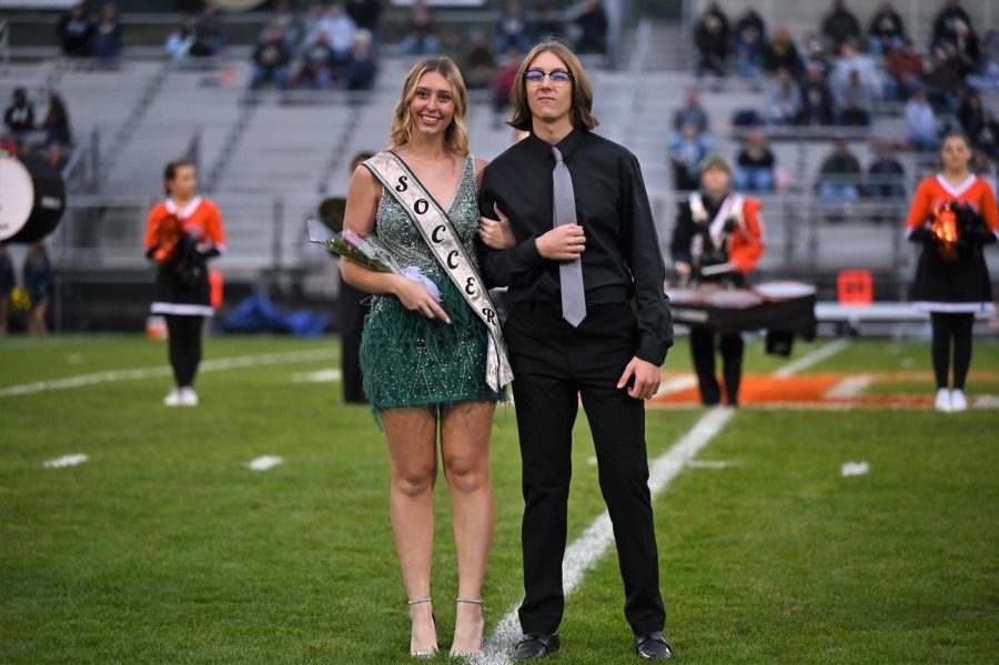 Avalyn Moore representing soccer and escorted by Carter Woomer.