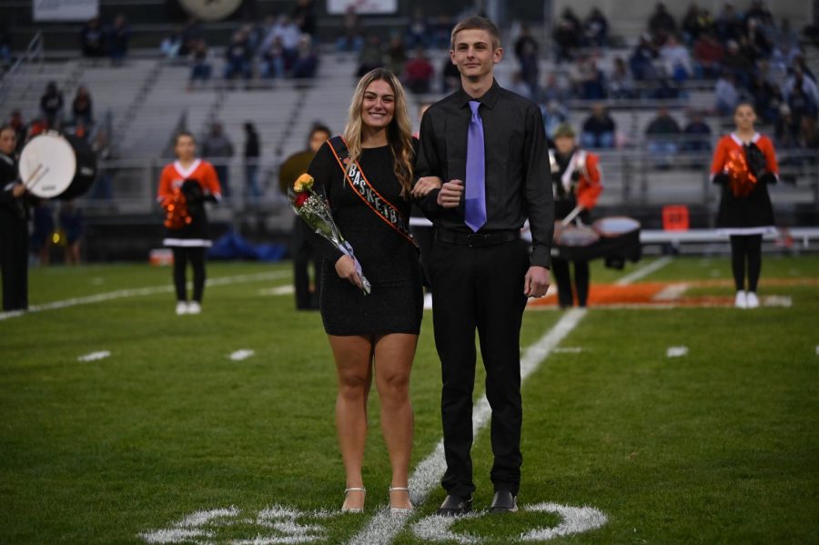 Alison Weston representing basketball and escorted by Leo Veit.