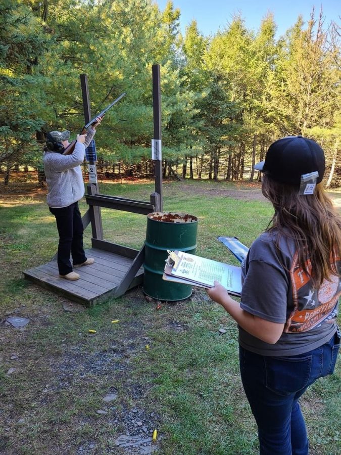 Clay Shoot – Sklenars – Denise Sklenar makes the call for the Tyrone Area FFA member who is serving as the trapper to release the clays.
