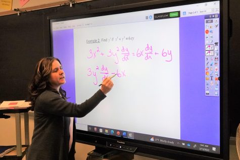 Michele Marasco teaching a math concept at her smartboard