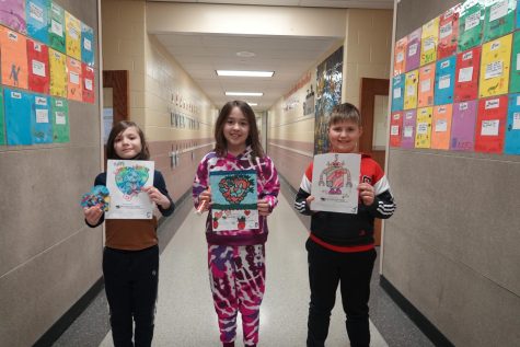 Fourth grade winners (Left to Right) second place winner James, first place winner Kendall, and third place winner Shane. 