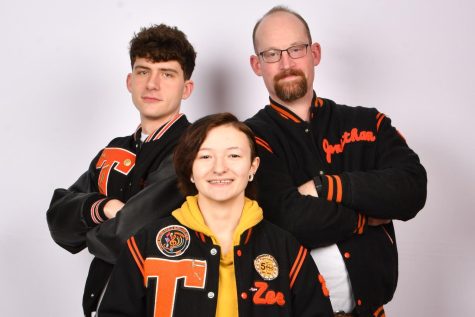 Tyrone senior Zac LeGars, senior Xena Sieminski and English teacher and TAHS Class of 2000 grad Jonathan Holmes model their varsity jackets.  