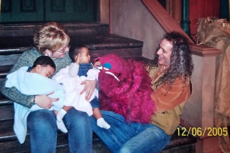 The twins and Melanie sitting on the steps with Telly Monster and Martin Robinson