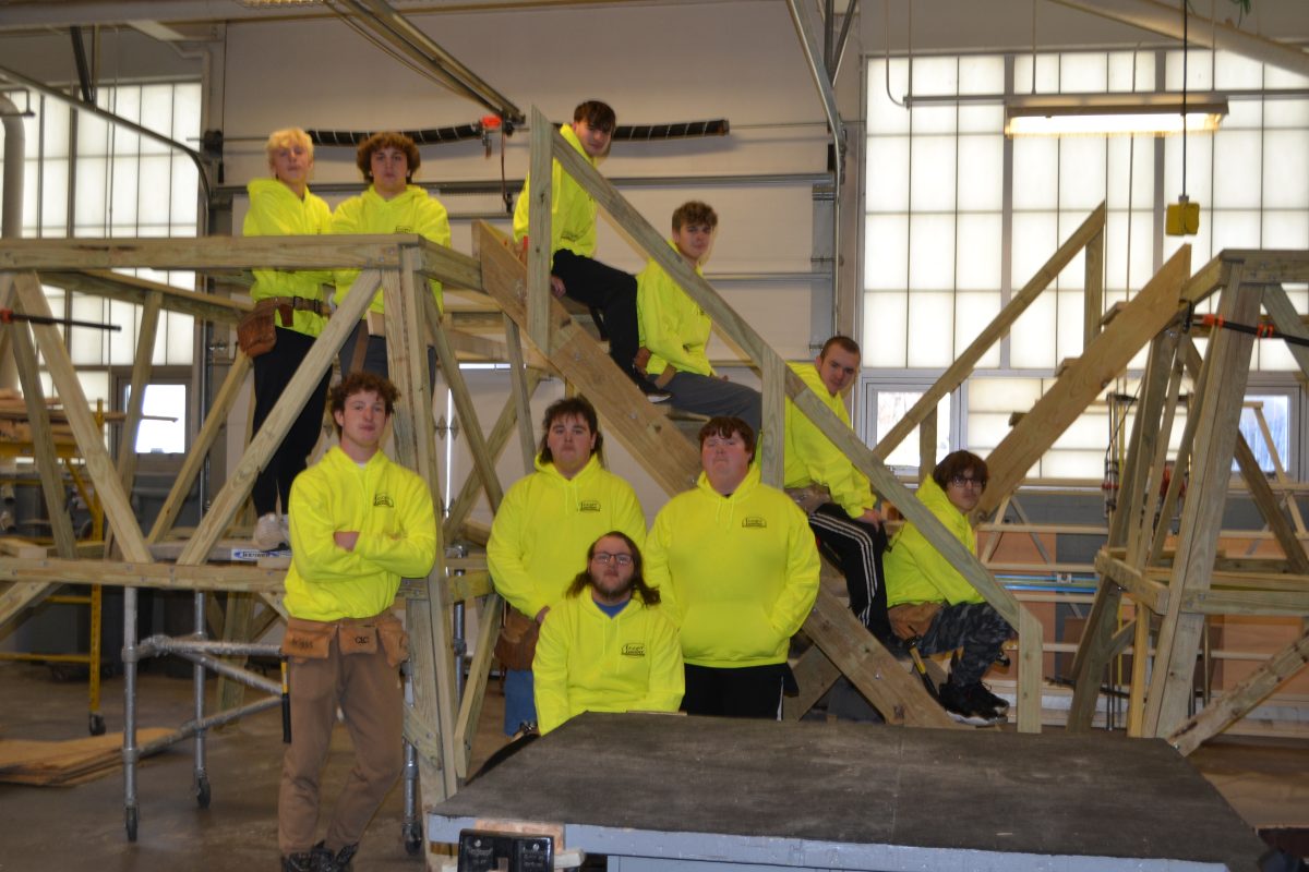 Students from Dan Plummers carpentry class show off their Lezzer Lumber sweatshirts.
