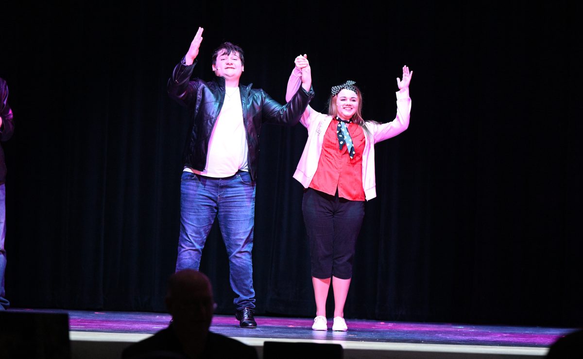 Jay Isenberg and Braylinne Shaw take a bow at the conclusion of Grease. 
