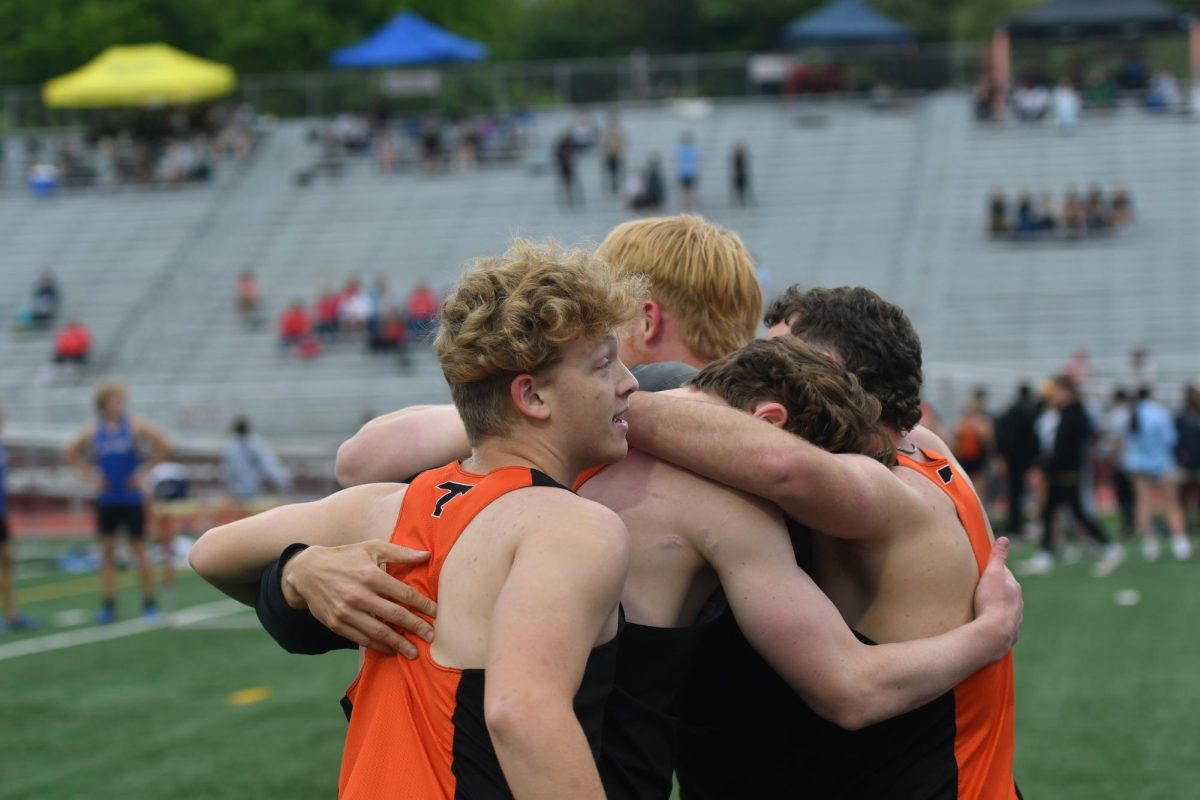Boys 4x100 relay celebrates their second place finish, which qualifies them for the state championship meet. 